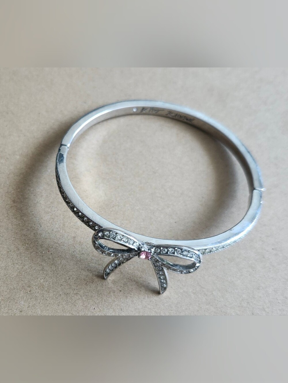Betsey Johnson Silver Bow Bracelet with Pink Stone